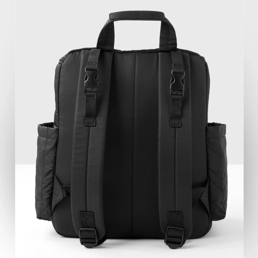 Skip Hop Forma Diaper Backpack. Black Exterior with Teal Interior.